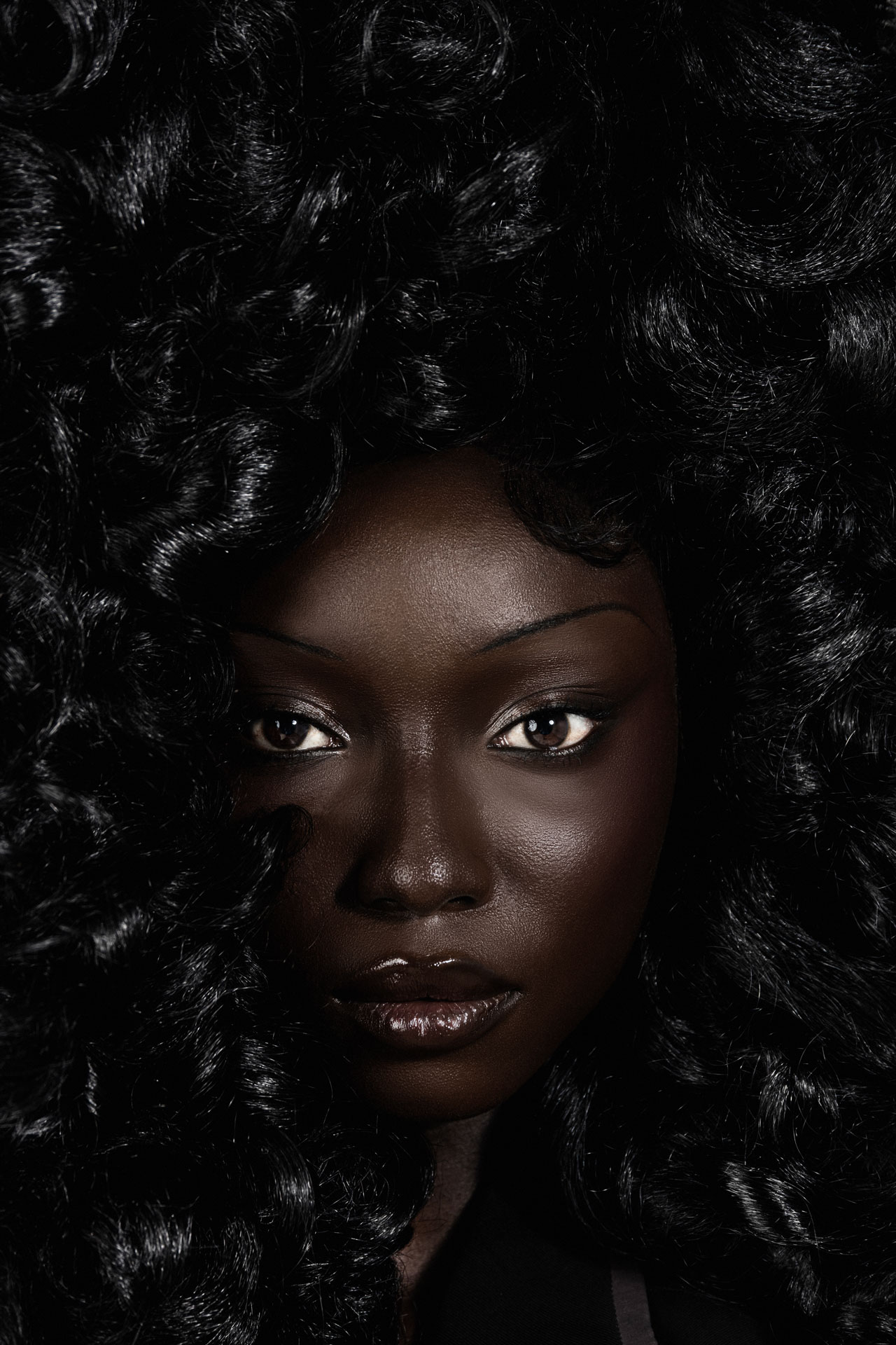 Black Twilight close beauty portrait with voluminous curls