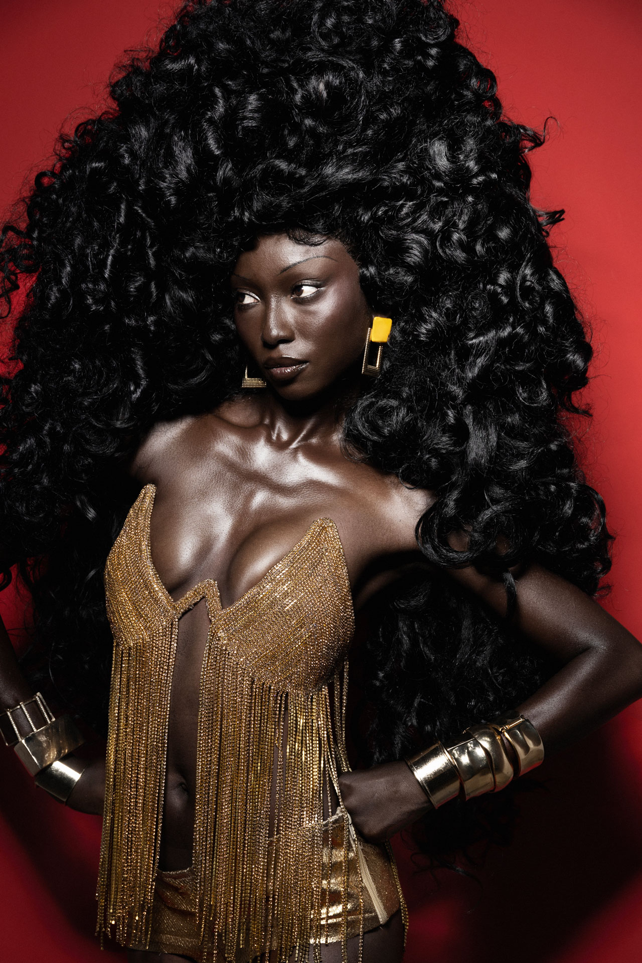Gold fringe portrait with hands at the hips