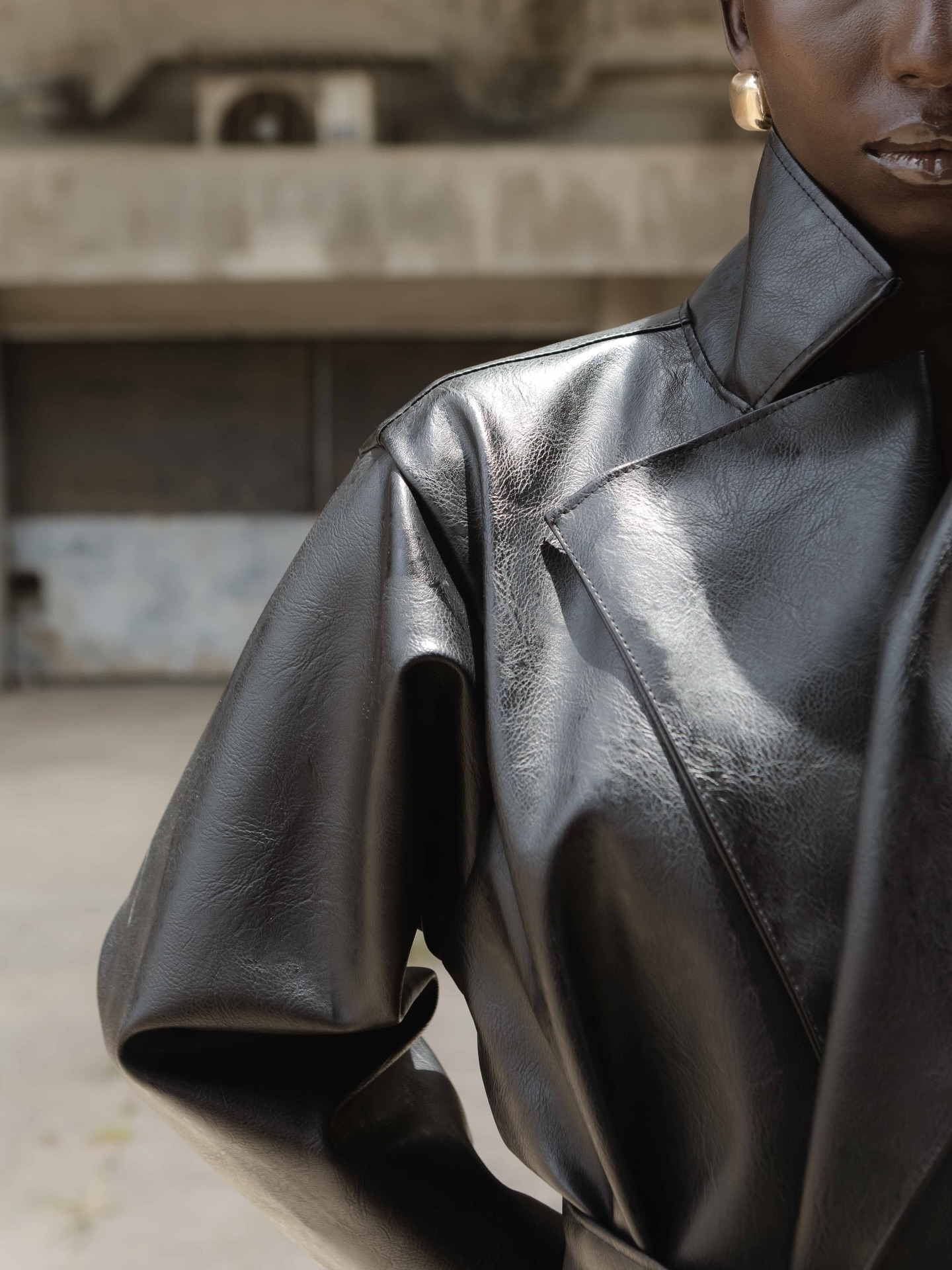 Close detail of the glossy coat collar and shoulder